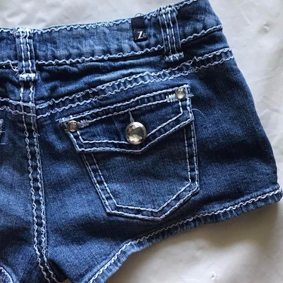 Low Rise Dark Blue Jean Shorts with White Stitching and Rhinestone Buttons - Picture 3 of 5